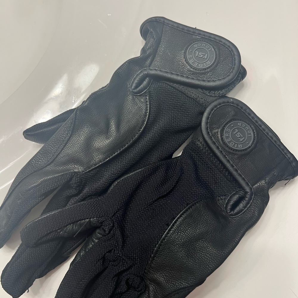 Riders touch horseback riding gloves. Never worn.